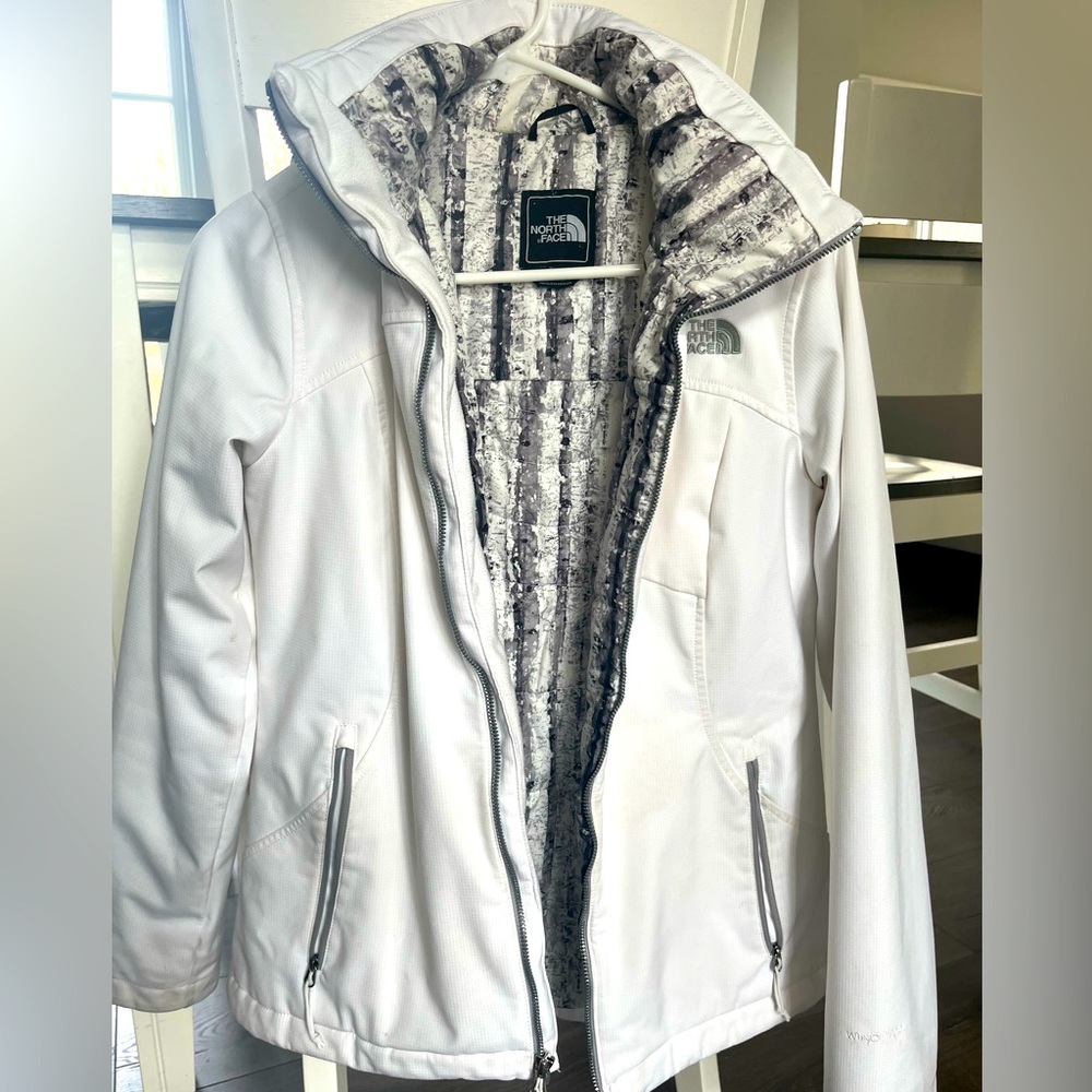 Small North Face ski jacket, white with detachable hood. Some discoloration